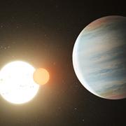 Discovery of a binary star orbited by three planets 